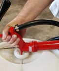 Person using Lincoln 1335 Lever Action Fluid Transfer Pump For 16 To 55 Gallon Drums With 8.5 Fluid Ounces Per Stroke, 2 Inch Bung