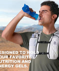 Man wearing Go-To 5L Hydration Vest for Running and Cycling with Dual 500ml Soft Flasks in outdoor setting