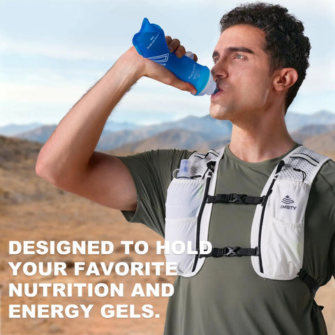 Man wearing Go-To 5L Hydration Vest for Running and Cycling with Dual 500ml Soft Flasks in outdoor setting