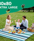 Family enjoying picnic on waterproof beach blanket for picnics and camping extra large sandproof outdoor rug portable XL