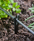 Heavy Duty Drip Irrigation Tubing Stake Set 6 Inch Plastic Black Stakes to secure supply tubing and keep emitters near roots