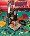 Multi Function Leather Hole Puncher Hand Press Tool for DIY crafting with accessories including embossing dies and leather samples on table