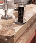 Heavy Duty Mini Turbo Angle Grinder Kit With 50 Millimeter Tungsten Cutters in action, carving wood with precision and producing shavings.