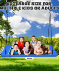 Children on 60 Inch Rectangle Tree Swing With 700 Pound Capacity Open Flat Platform Heavy Duty Waterproof For Kids And Grownups Includes Installation Kit And 2 Tree Straps Blue in a park.