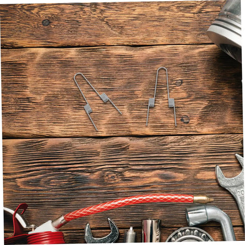 Upgrade Your Kitchen Trash Can With This 4 Piece Stainless Steel Torsion Spring Kit Featuring Dual Coil Design For Easy DIY Installation And Stable Lid Operation On Various Household Garbage Bins You Will Love This Quick Fix Solution. 4 stainless steel springs on wood surface