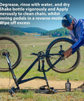 Cyclist applying No Nonsense Dry Bike Chain Lube For MTB With Ceramic Coating And PTFE to a mountain bike in a scenic outdoor setting