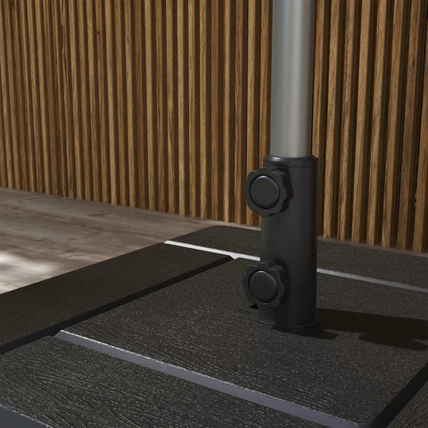 Close-up of Three In One Outdoor Umbrella Base, Coffee End Table, And Planter Box With Drain Hole in black on wooden deck
