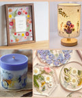 Assorted handmade crafts using pressed flowers, including a framed art, decorative lamp, floral candle, and resin coasters.