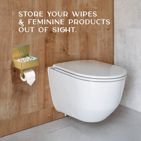Toilet Paper Holder With Shelf Wall Mount In Gold For Modern Bathrooms next to a toilet, holding wipes and toilet paper