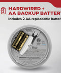 Rock Solid Hardwired Smoke Detectors With AA Battery Backup And Interconnectable Wiring For Whole House Coverage Includes Bright LED Indicators And A Kickin Loud Alarm In A Four Pack Setup showing internal AA battery compartment.