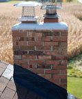 Brick chimney with black flashing sealed with Chimney Flashing Sealer And Roof Sealant That Keeps Water Out, Flexible Waterproof Sealant
