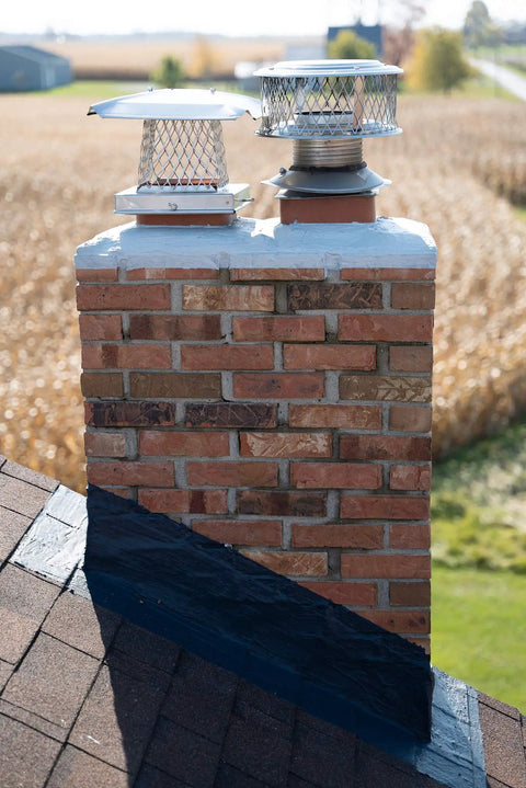 Brick chimney with black flashing sealed with Chimney Flashing Sealer And Roof Sealant That Keeps Water Out, Flexible Waterproof Sealant