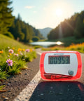 Red Portable Pedometer With Mini Digital LCD Display, All In One Step Counter For Walking And Running, Tracks Distance In Miles, Calorie Burn, Daily Target, Exercise Time, Compact And Easy To Use on a road