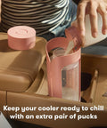 Definitely A Game Changer For Pumping Moms Reusable Breast Milk Cooler Ice Packs in use with a milk bottle in a car.