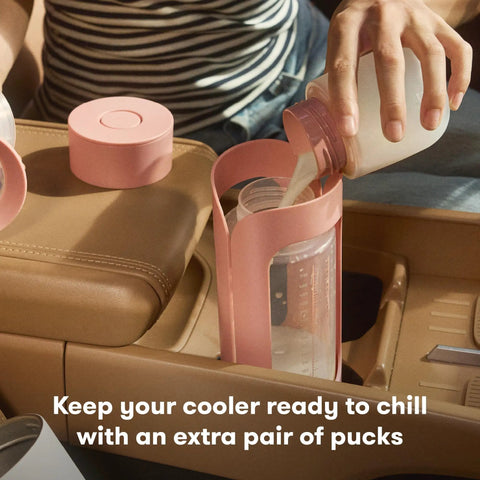 Definitely A Game Changer For Pumping Moms Reusable Breast Milk Cooler Ice Packs in use with a milk bottle in a car.