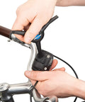 EWS1 Electronics 3 Way Tool For Bike Systems With Angled Di2 E Tube Ends For Tight Space Install And Removal in use on handlebar