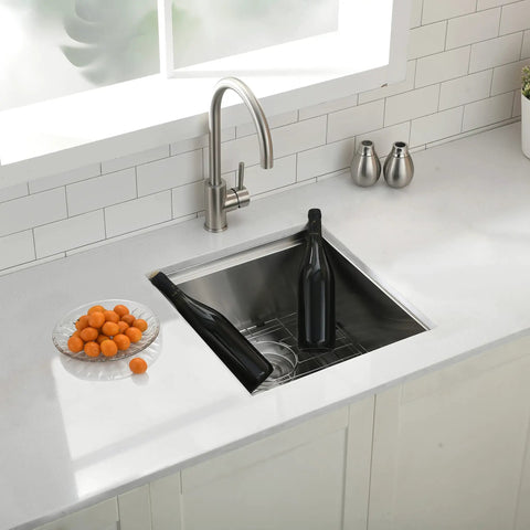 Undermount Bar Sink 13x15 Inches 16 Gauge Stainless Steel Deep Basin Nine Inch Depth With Three And A Half Inch Drain For Garbage Disposal Built Like A Boss For Small Home Bars And Kitchen Prep in a countertop with faucet and oranges