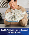 Smiling person holding Millennium Falcon 3D Model Kit For Star Wars Fans And Collectors, Epic Desk Decor And Dope Build Puzzle, 223 Pieces