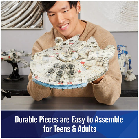 Smiling person holding Millennium Falcon 3D Model Kit For Star Wars Fans And Collectors, Epic Desk Decor And Dope Build Puzzle, 223 Pieces