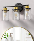 Chic Brushed Nickel 3 Light Vanity Light Over Mirror With Clear Glass Shades on bathroom wall above mirror