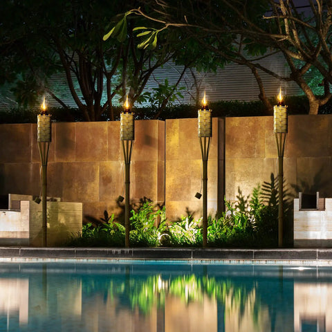 Bamboo Tiki Torches Outdoor Mosquito Repellent 12 Pack, 60 Inch Tall Garden And Backyard Lights by a pool; citronella oil lamps.