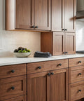 Flat Black Cabinet Knobs 10 Pack Round One And One Quarter Inch Solid Zinc Metal Matte Finish on wood kitchen cabinets