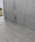 Hella Durable 60 Inch Stainless Steel Linear Shower Drain Featuring Sleek Polished Chrome Surface in modern shower design.
