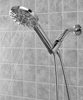 Biarritz 7 Setting Hand Held Filtered Shower Handle With Chlorgon Filtration For Chlorine Removal And Odor Control Replaceable HHC Filter Cartridge Lasts 3 Months Or 5000 Gallons NSF Certified Chrome, attached to a shower wall with water flowing