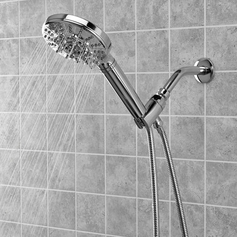 Biarritz 7 Setting Hand Held Filtered Shower Handle With Chlorgon Filtration For Chlorine Removal And Odor Control Replaceable HHC Filter Cartridge Lasts 3 Months Or 5000 Gallons NSF Certified Chrome, attached to a shower wall with water flowing