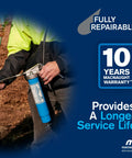 Person using Beefy Heavy Duty Pistol Grip Grease Gun With Ten Year Warranty Bulk Fillable Or Fourteen Ounce Cartridge One Eighth NPT Flex Connection Twelve Inch Hose KY Supergrip Three Jaw High Pressure Coupler No Leak Connection outdoors.