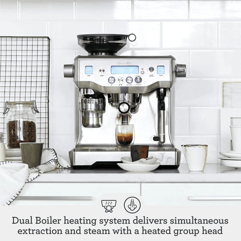 Oracle Fully Automatic Espresso Machine In Brushed Stainless Steel With 58 mm Portafilter Integrated Grinder And Slick Milk Frother on kitchen countertop.
