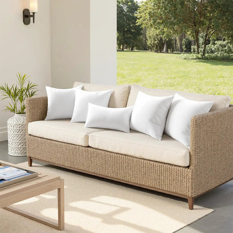 18x18 Outdoor Throw Pillows Set Of 4 Waterproof Cushions for patio on a wicker sofa