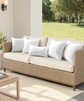 Two Pack 12x20 Inch Outdoor Throw Pillows Waterproof for Patio and Garden on woven sofa in outdoor living area