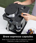 Espresso And Coffee Maker Barista System With Built In Frother Three Espresso Brew Styles Nespresso Capsule Compatible 19 Bar Pressure For Rich Crema At Home Cafe Quality Espresso Cappuccino And Latte Maker Black in use on countertop