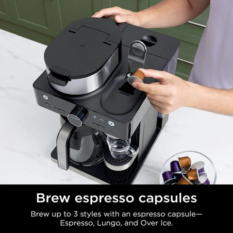 Espresso And Coffee Maker Barista System With Built In Frother Three Espresso Brew Styles Nespresso Capsule Compatible 19 Bar Pressure For Rich Crema At Home Cafe Quality Espresso Cappuccino And Latte Maker Black in use on countertop