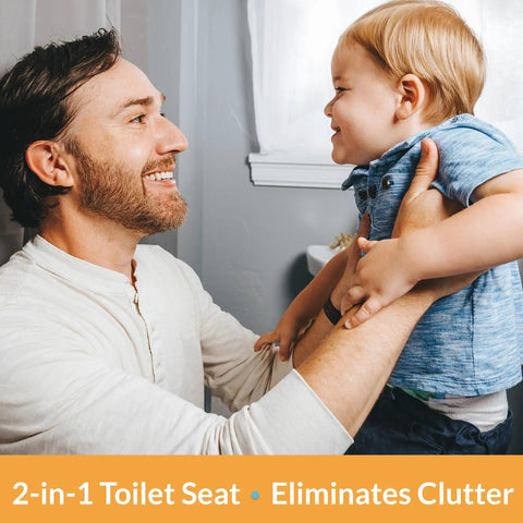 Father and son in bathroom featuring 2 In 1 Elongated Toilet Seat With Built In Toddler Potty Training Seat Slow Close Easy To Install White Made In USA Space Saving Family Bathroom Upgrade For Adults And Kids.