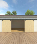 Beefy 20 Foot Black Box Rail Exterior Barn Door Hardware Kit For Two Doors installed on outdoor white building front view