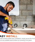 Man installing Rock Solid Universal One Inch Caster Wheels Set Of Eight Featuring Silky Smooth Ball Bearings In Matte Black.