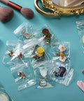 Clear Jewelry Zipper Bags For Packaging Rings And Earrings, Anti Tarnish And Waterproof, Transparent Poly Pouches, 2.75 By 4 Inches, 100 Pack, with earrings and rings displayed