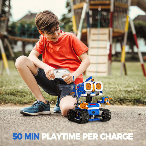 Boy playing with 5 In 1 STEM Robot Building Kit With 560 Pieces For Ages 8 12 App Controlled Remote Control Coding Toys