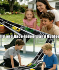 Kids playing with Ultra Long 16.4-Foot Flexible Race Track For Kids 3 And Up, Dual Lane Roll-Up Set With 4 Cars outdoors