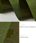 Close-up of green Beefy Weatherproof Canvas Tarp for Outdoors, showing resin coating and water resistance, 6.6 by 4.9 feet.