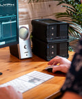 Heavy Duty 48TB Thunderbolt Three Desktop Raid Storage Array With Enterprise 7200RPM Drives, dual units beside a monitor.