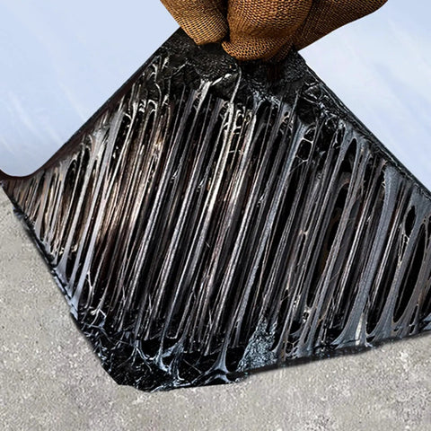 Self Adhesive Ice And Water Shield Roof Underlayment Roll No Sweat Asphalt Shingle Repair Tape being unrolled and applied.