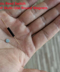 10 Pack Plastic Reed Switches No Magnetic Induction Sensor with Small Round Magnets in a person's hand.