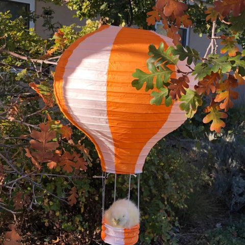 Hot Air Balloon Paper Lantern Decor Set Of 6 With Striped Blue Green Pink Orange Yellow Patterns 12 Inch Diameter And 16 Inch Expanded Height Perfect For Weddings Birthday Engagements Christmas Party Decor Party Ready Vibe. Large orange and white striped paper lantern resembling a hot air balloon hanging among trees.