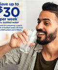 Person drinking water from glass, promoting savings with Lead Reducing Faucet Mount Water Filter With Easy Install, 100 Gallon Capacity