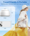 Keep Your Mouth Straight Fire Clean With This Ultrasonic Retainer Cleaner Using 45Khz Uv Deep Tech to show portable retainer cleaner size next to phone.
