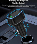 Hella Fast 75W USB C Car Charger With Three Ports delivering PD 3.0 and QC 3.0 power plugged into a car cigarette lighter socket.
