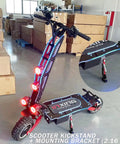 An electric scooter with LED lights, equipped with a Universal Kickstand Bracket for Motorcycles Dirt Bikes And Scooters With 55mm Hole Spacing, Heavy Duty Steel Side Stand Mount, No Fuss Install With Screws, Anti Rust Finish, Fits Most Bikes.